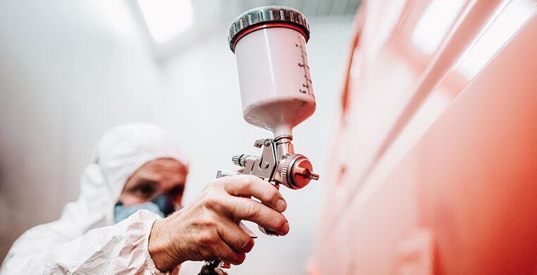 single-services-close-up-paint-spray-gun-worker-painting-car